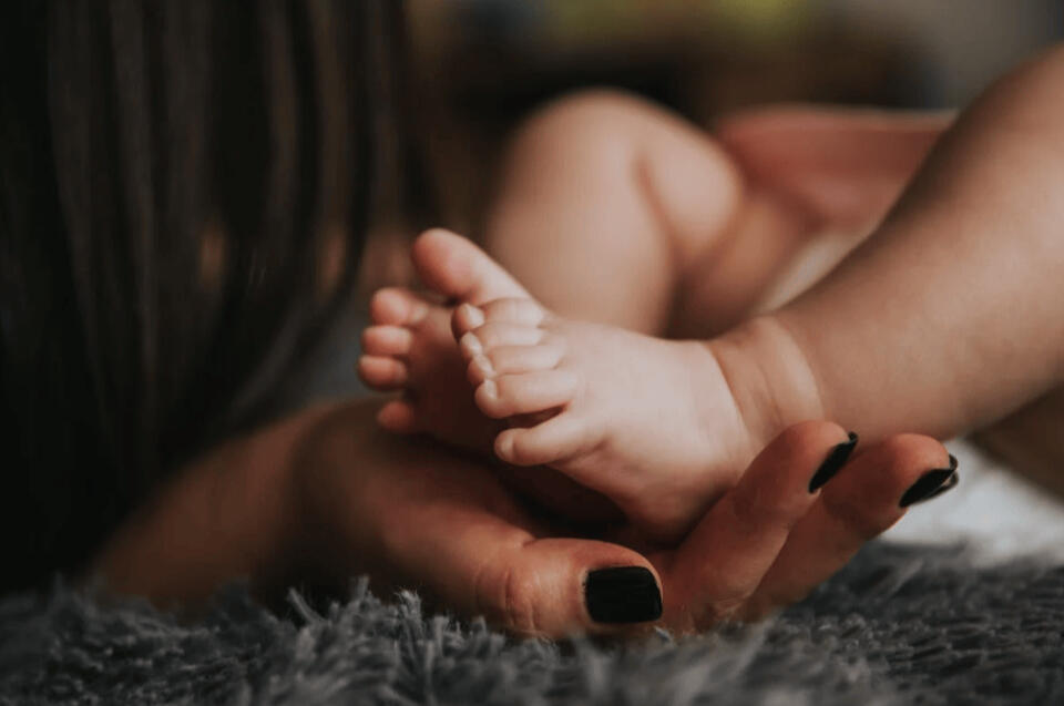 Newborn dainty feet being read psychically for their life purpose and soul guidance